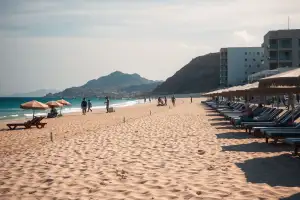 Golden sands meet turquoise waters at Mackenzie Beach, a perfect Larnaca day trip destination