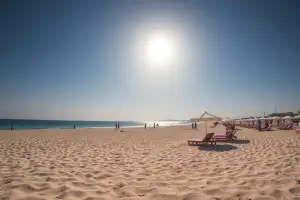 Larnaca's Finikoudes Beach offers golden sands and palm trees, perfect for a relaxing day trip near the airport